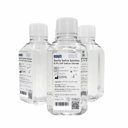 Three bottles of UFC BIO 0.9% Sterile Saline Solution on a white background 